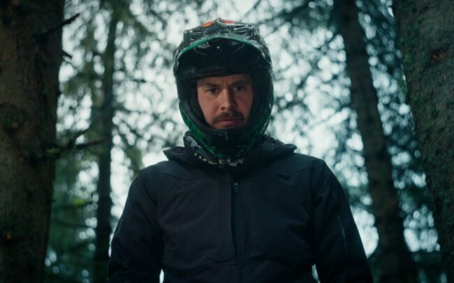 Stevie Schneider standing on top of a self built North Shore trying to focus.