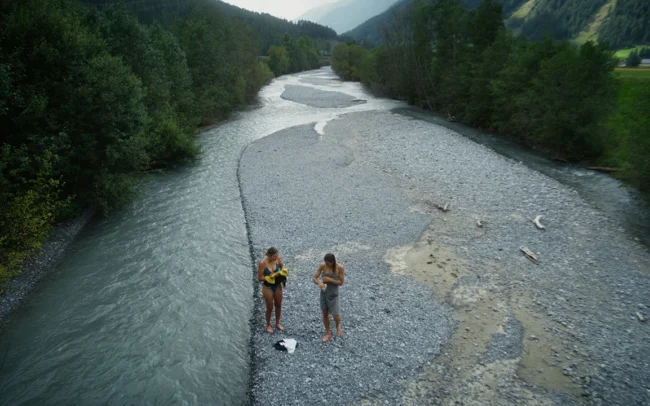 Magdalena Mittersteiner and Elisa Deutschmann bathing in a cold river.